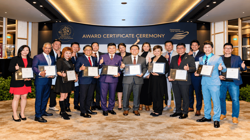 Group of Entrepreneur of the Year Award 2023/24 recipients holding award certificates in Singapore