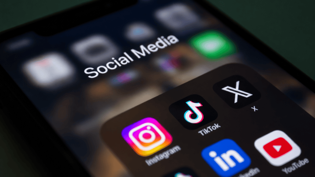 Social media platforms for businesses displayed as apps on a smartphone
